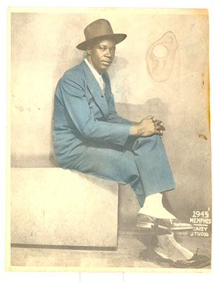 Not all photo restorations have to be heroic efforts. The restoration of this dapper gentleman's 1945 portrait (note the spats he's wearing) only required stain removal and color correction. Total restoration time was about 2 hours.